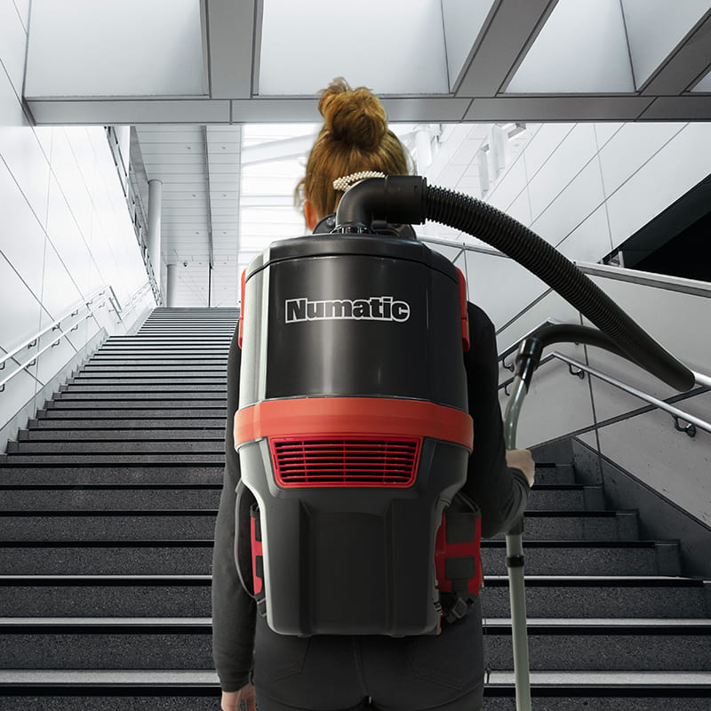 Numatic Backpack Vacuum with Battery rear up stairs